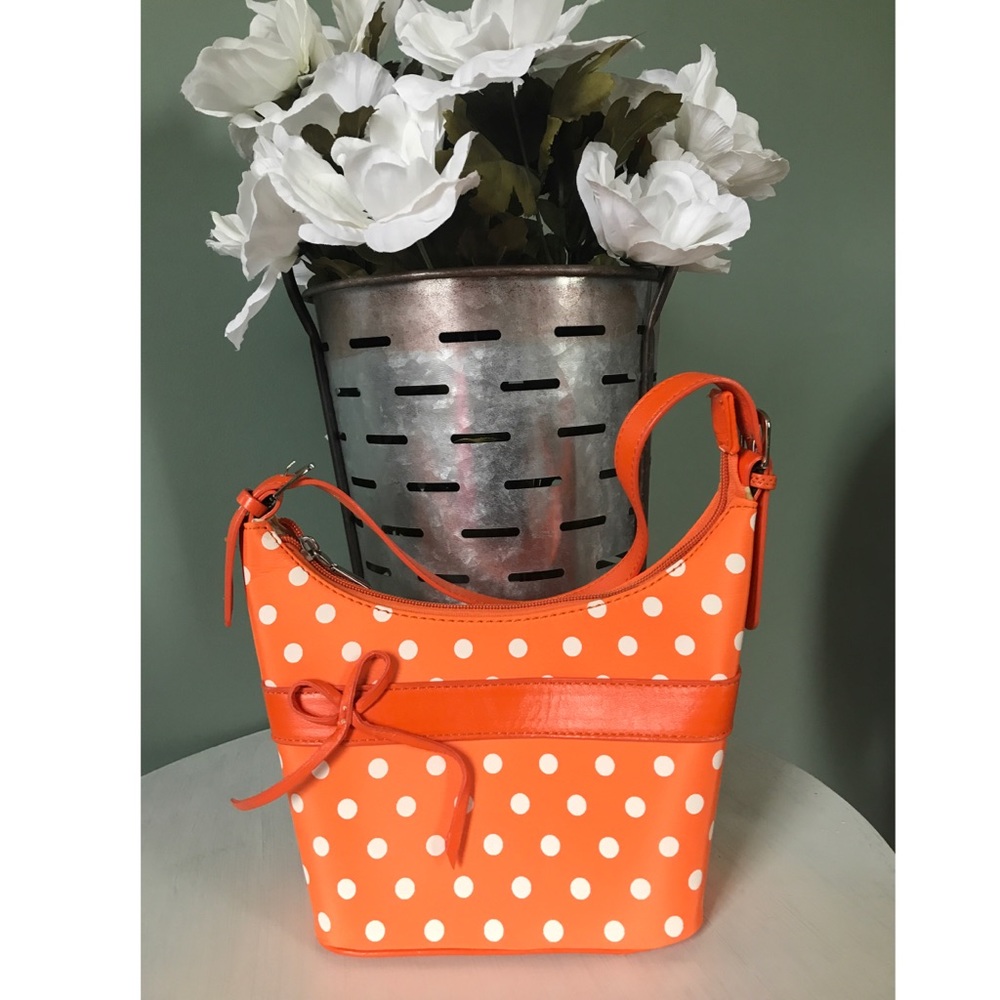 Orange purse with white polka dots